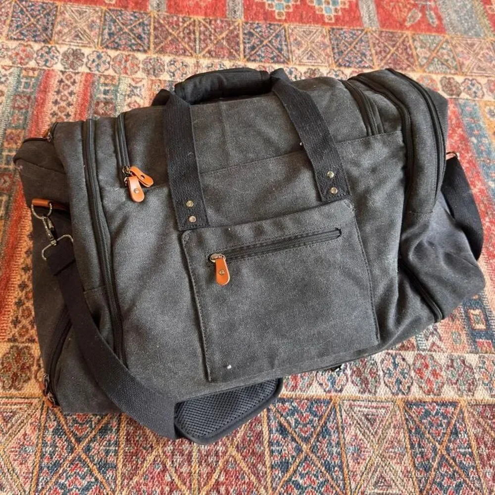 Sucipi Black canvas duffle bag with leather accents